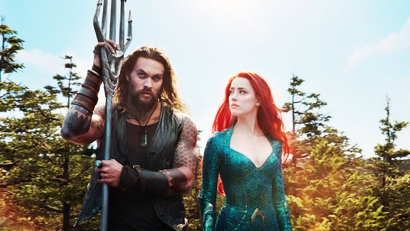 Jason Momoa and Amber Heard in Aquaman.