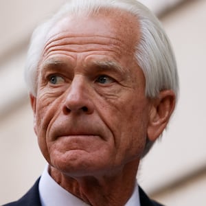 Peter Navarro speaks to reporters outside a federal courthouse.