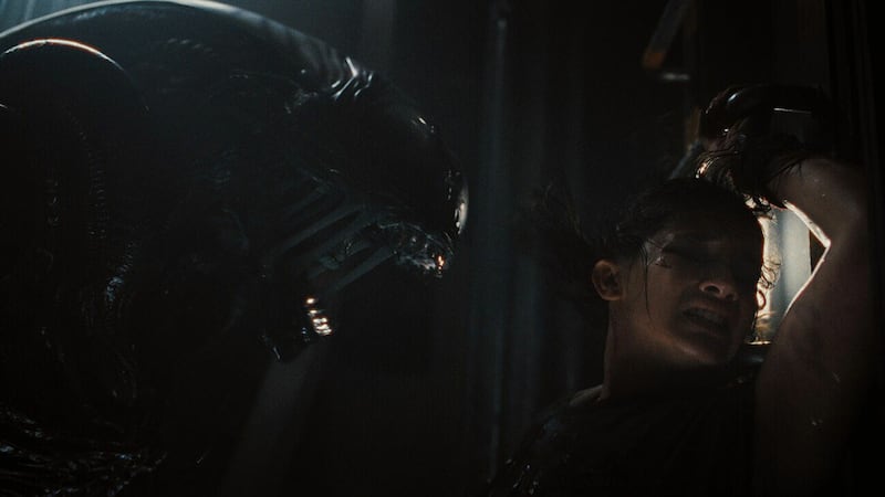 A photo still of Xenomorph and Cailee Spaeny