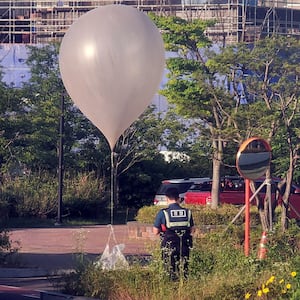 A balloon believed to have been sent by North Korea, carrying various objects including what appeared to be trash, is pictured at a park in Incheon, South Korea, June 2, 2024.