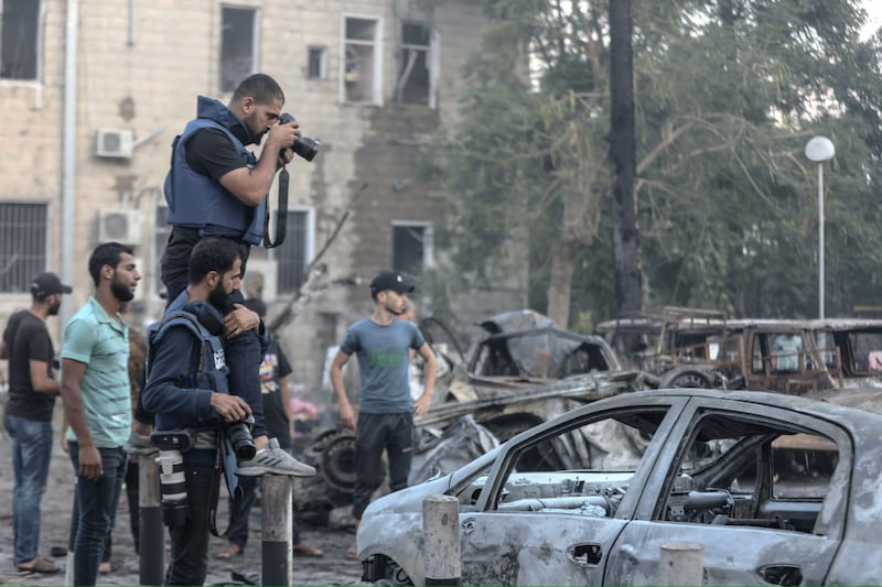 Photograph of Ali Jadallah taking a photo in Gaza