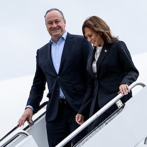 U.S. Vice President Kamala Harris and second gentleman Douglas Emhoff descend from Air Force Two at Delaware National Air Guard base in New Castle, Delaware, on July 22, 2024. 