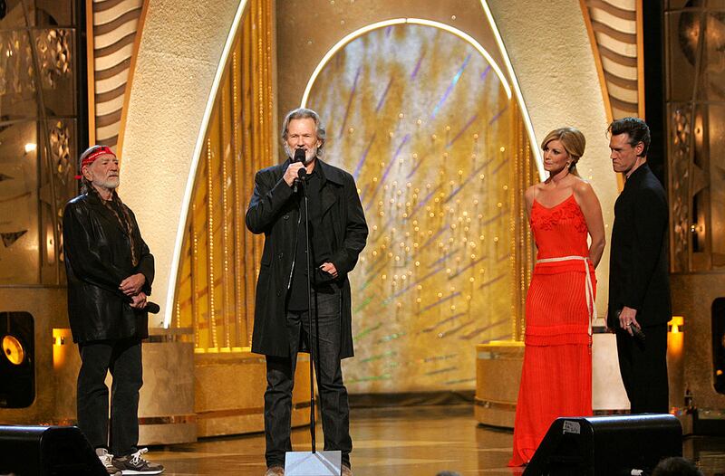 From left to right: Willie Nelson, Music Hall of Fame Inductee Kris Kristofferson, Faith Hill and Randy Travis perform on stage at the 38th Annual CMA Awards.