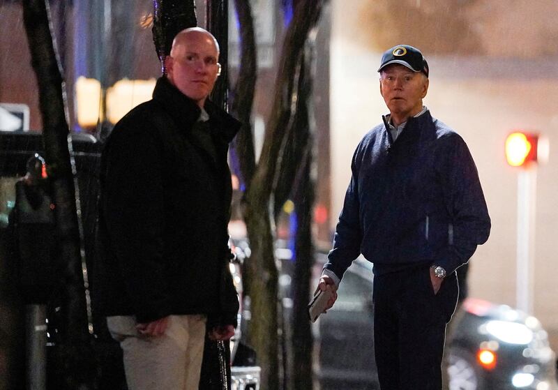 Joe Biden stares in the direction of a car that crashed into his motorcade.