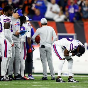 TreDavious White #27 of the Buffalo Bills reacts to an injury sustained by Damar Hamlin #3 during the first quarter of an NFL football game against the Cincinnati Bengals.