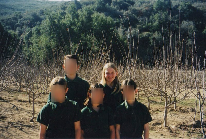 An undated photo from the 1990s shows a young Emily Armstrong at the apple orchard at Scientology's PAC Ranch, which was used to house youth members, near Santa Clarita, California.