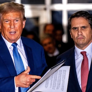 Former President Donald Trump speaks alongside his attorney Todd Blanche at Manhattan Criminal Court in New York City.