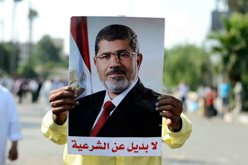 articles/2013/07/03/the-mexican-standoff-in-egypt/morsi-egypt-update-cheat_pkoytw