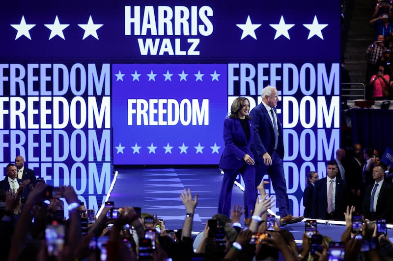 Democratic presidential candidate Kamala Harris and her running mate, Minnesota Governor Tim Walz, attend a campaign rally in Milwaukee, Wisconsin, on August 20, 2024.