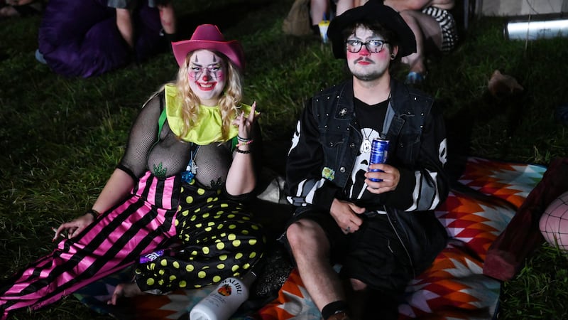 Two fans pose together at the 2023 Gathering of the Juggalos