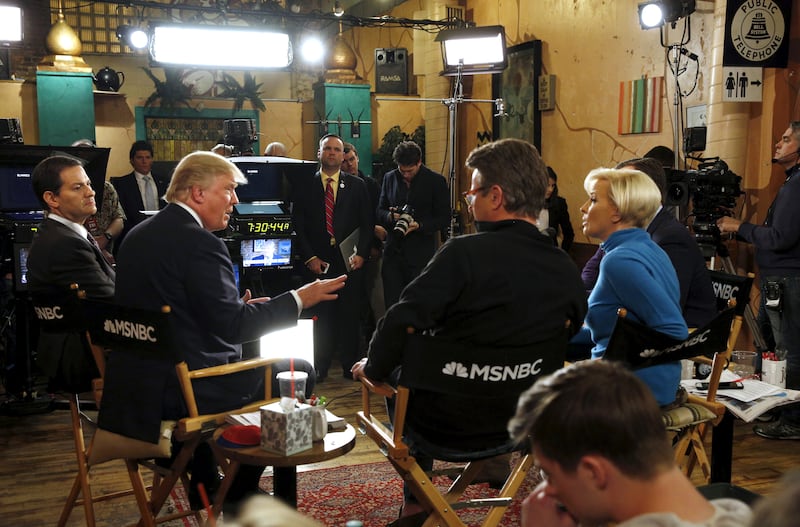 Republican presidential candidate Donald Trump talks to Joe Scarborough and Mika Brzezinski during an appearance on MSNBC's "Morning Joe" at Java Joe's CoffeeHouse in Des Moines, Iowa on January 15, 2016.