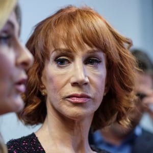 Kathy Griffin watches as her attorney speaks at a news conference