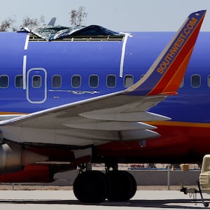 A Southwest Airlines Boeing plane sits at the Yuma International Airport in 2011, after the plane had a section of fuselage tear from the plane during a flight.