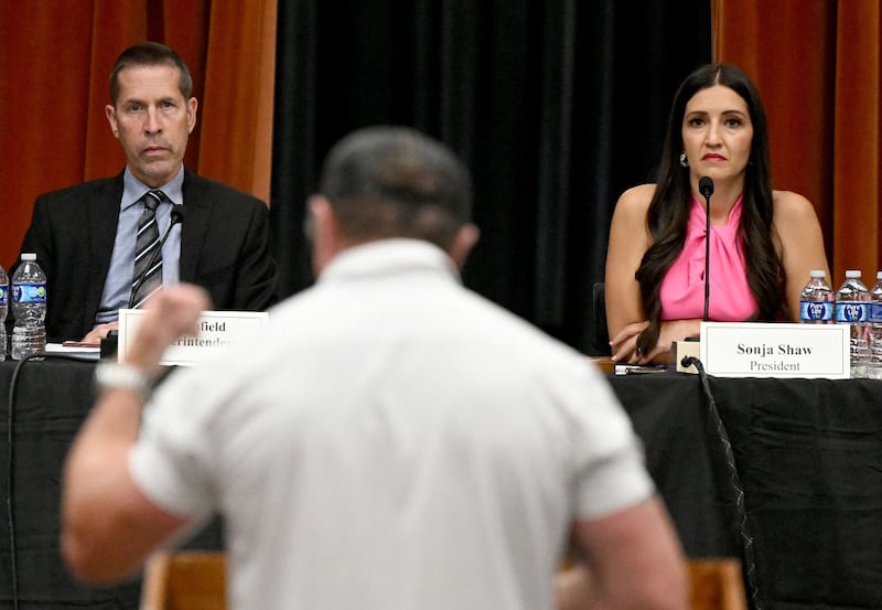 Chino Valley Unified School District Superintendent Dr. Norm Enfield and President Sonja Shaw listen to a speaker during a board meeting ahead of the board’s vote to requiring schools to notify parents if their child changes their pronouns.