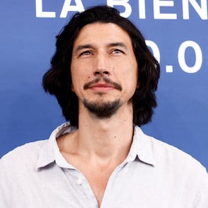 Adam Driver poses for a photo at the Venice Film Festival