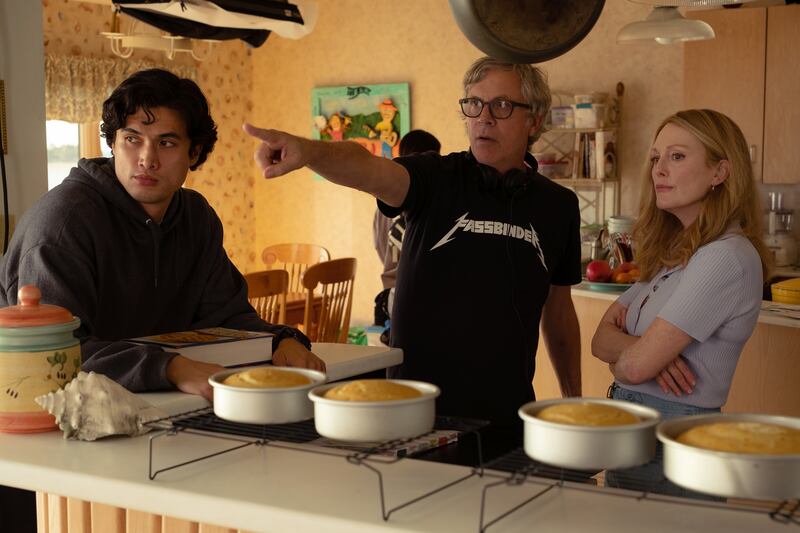 Photo of Charles Melton, Todd Haynes, and Julianne Moore on set filming 'May December;