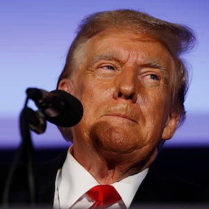 Former President Donald Trump talks to supporters during a campaign rally at the Sheraton Portsmouth Harborside Hotel