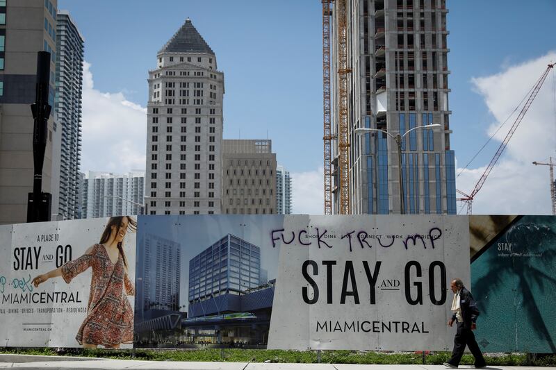 Graffiti across the street from the Wilkie D. Ferguson Jr. United States Courthouse in Miami, where Trump is set to be arraigned on Tuesday. 