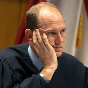 Judge Scott McAfee presides over a hearing for Harrison Floyd at the Fulton County Courthouse