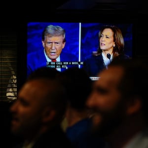 People watch the presidential debate between Republican presidential nominee Donald Trump and Democratic presidential nominee Kamala Harris at a watch party in New York City on September 10, 2024.