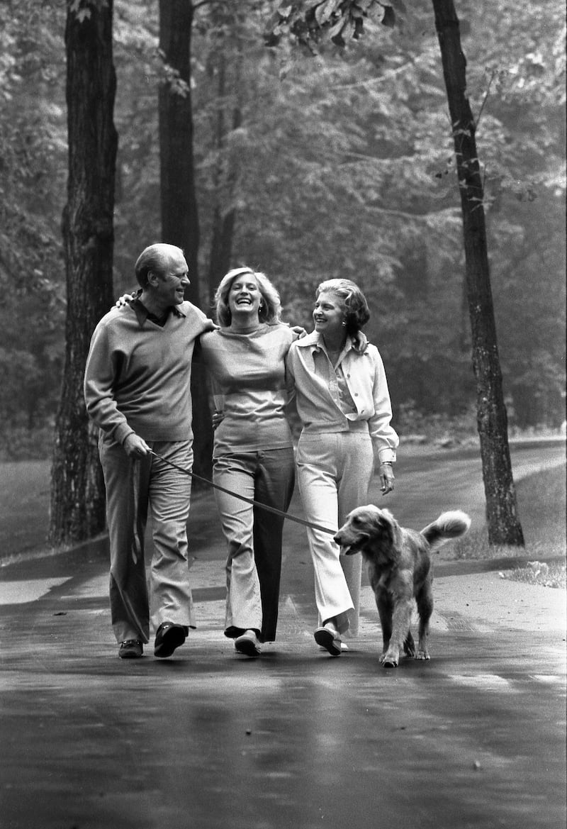 Susan Ford Bales walks with her dad and mom while at Camp David during Gerald Ford’s presidency.