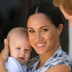 Harry and Meghan, holding their son Archie, meet Archbishop Desmond Tutu (not pictured) at the Desmond & Leah Tutu Legacy Foundation in Cape Town, South Africa, September 25, 2019.