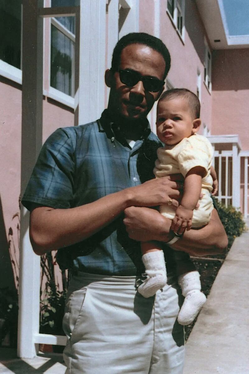 Donald Harris holding his daughter Kamala in April 1965.