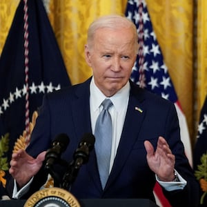 Joe Biden speaks to reporters during a press conference.