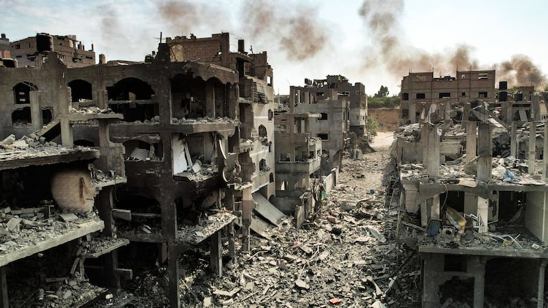 A photo including an aerial view of buildings destroyed by Israeli air strikes in the Jabalia camp for Palestinian refugees in Gaza City.