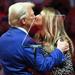 Donald Trump joins his wife Melania Trump on stage during a campaign rally at Madison Square Garden.