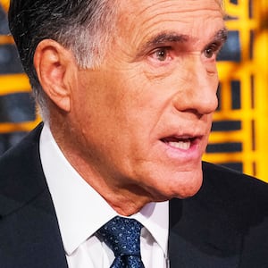 A close up picture of Mitt Romney speaking on a talk show