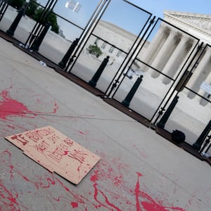 A protest sign at the U.S. Supreme Court