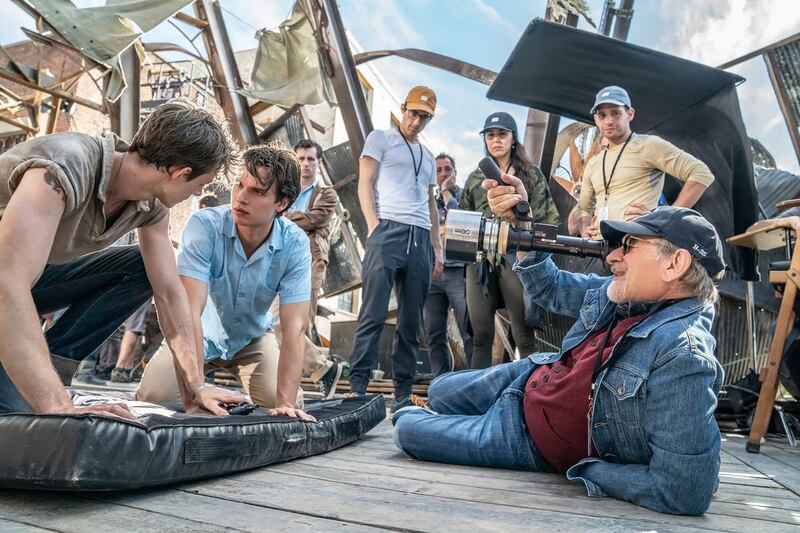 Justin Peck (center) on the set of West Side Story with Steven Spielberg