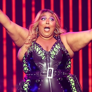 A picture of Lizzo performing. Lizzo has been accused of creating a hostile work environment by allegedly fat shaming and sexually harassing three of her former dancers, according to a lawsuit.