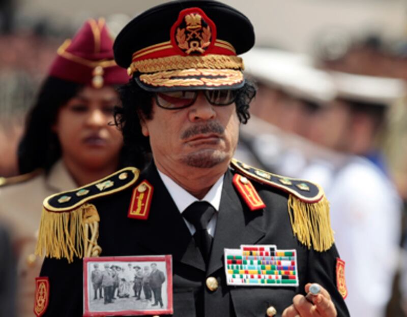 articles/2011/02/23/libyan-leader-muammar-gaddafis-25-strangest-moments/1---graham-gaddafi-moments_wisqk9