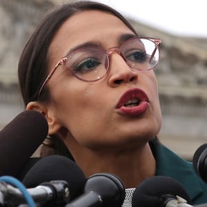 image of alexandra ocasio cortez speaking at capitol hill congress aoc green new deal ed markay resolution non binding environment climate change