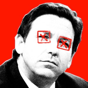 Photo illustration of Ron DeSantis with "x"s over his eyes on a red background