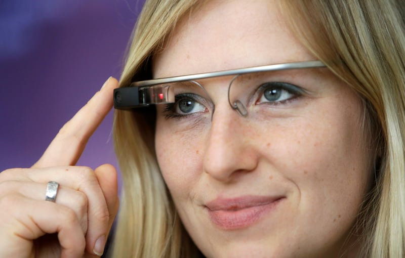 A woman wears Google glass after a media presentation of a Google apartment in Prague May 15, 2014.