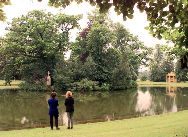 Members of the public view the lake at Althorp with the Diana Urn on the Island and the Diana Doric Temple to the right, July 1, 1998. The Estate opened its gates for the first time that day, on what would have been Princess Diana's 37th birthday.