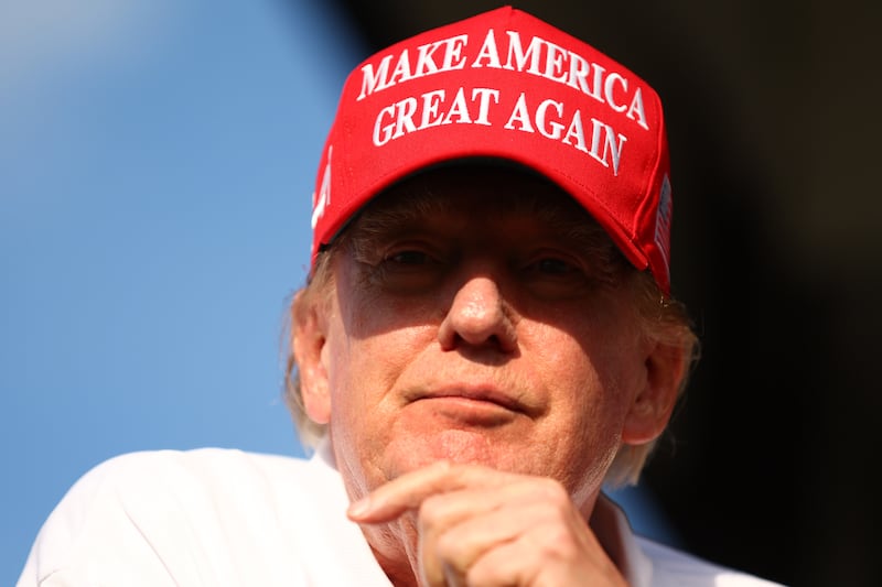 Former president Donald Trump looks on at the 18th green during day three of the LIV Golf Invitational - Miami at Trump National Doral Miami