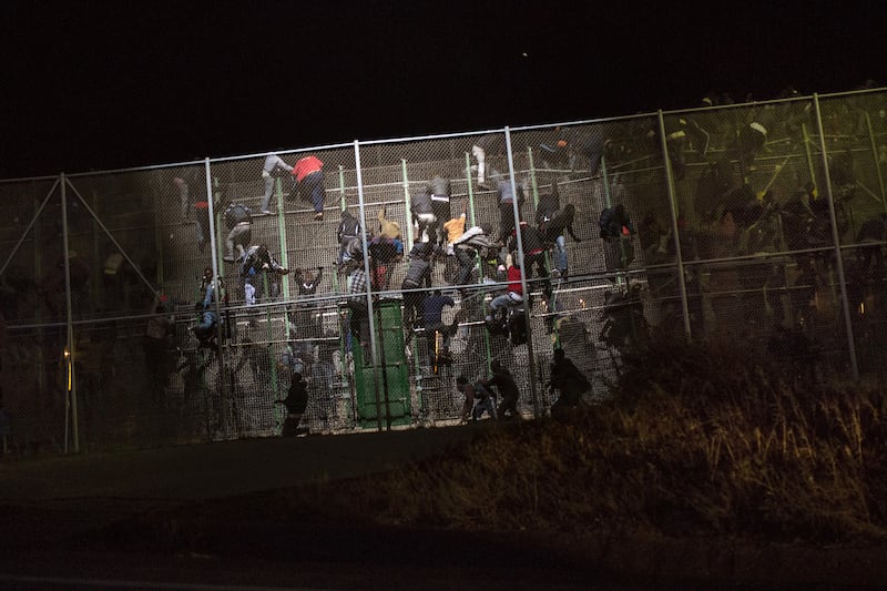 articles/2014/06/03/cardinal-o-malley-s-fight-against-global-indifference-to-immigration-s-humanitarian-crisis/140530-spain-fence14_x82o4n