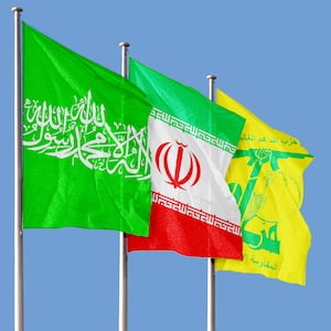 A photo illustration of the flags of Hamas, Iran, and Hezbollah.