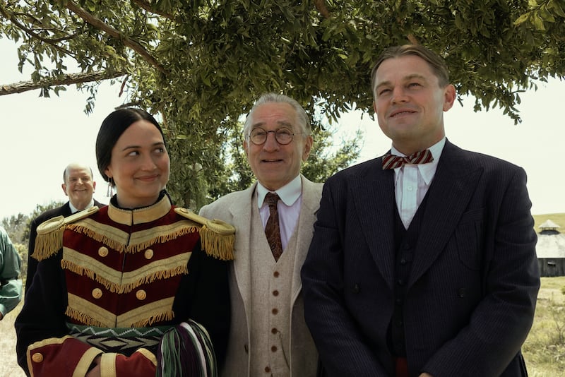 Photo still of Lily Gladstone, Robert De Niro, and Leonardo DiCaprio in 'Killers of the Flower Moon'