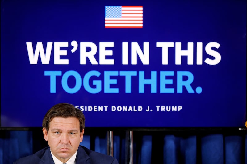 Gov. Ron DeSantis attends a 2020 event at a Florida golf club, featuring former President Donald Trump.