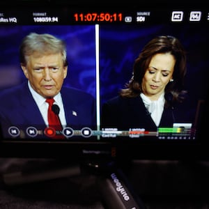 TV showing a spilt screen of Trump and Harris during the debate