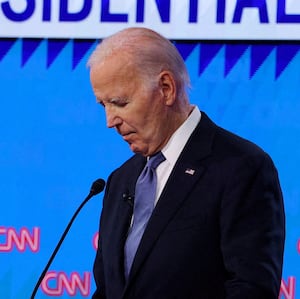 President Joe Biden listens as Republican presidential candidate and former U.S. President Donald Trump speaks during their debate in Atlanta, Georgia.