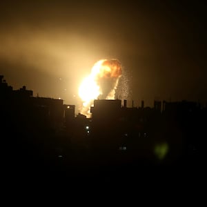 An explosion is seen during Israeli air strikes in the southern Gaza Strip