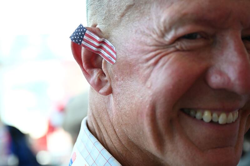 A person has a American flag bandaid on his ear on the first day of the Republican National Convention in Milwaukee, Wisconsin. 