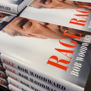 Copies of Bob Woodward’s 2020 book ‘Rage,’ featuring Donald J. Trump on the cover