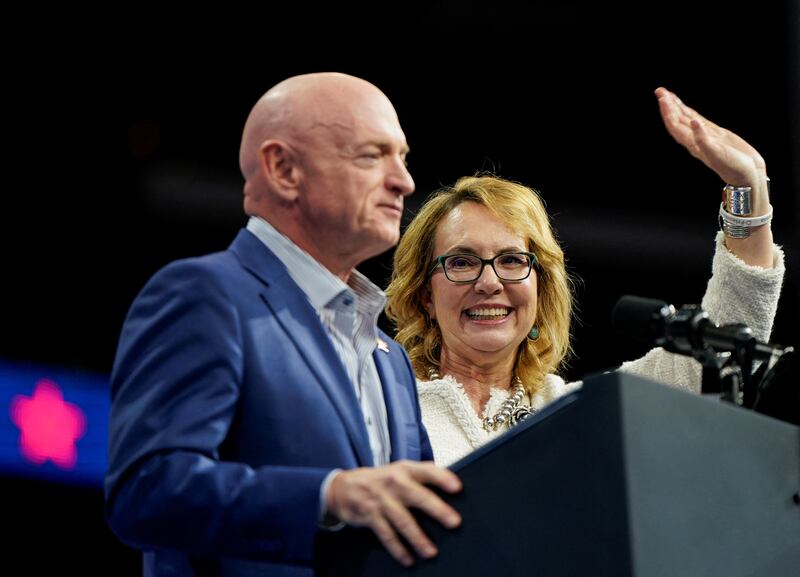 Gabby Giffords and her husband, Sen. Mark Kelly, speak on stage